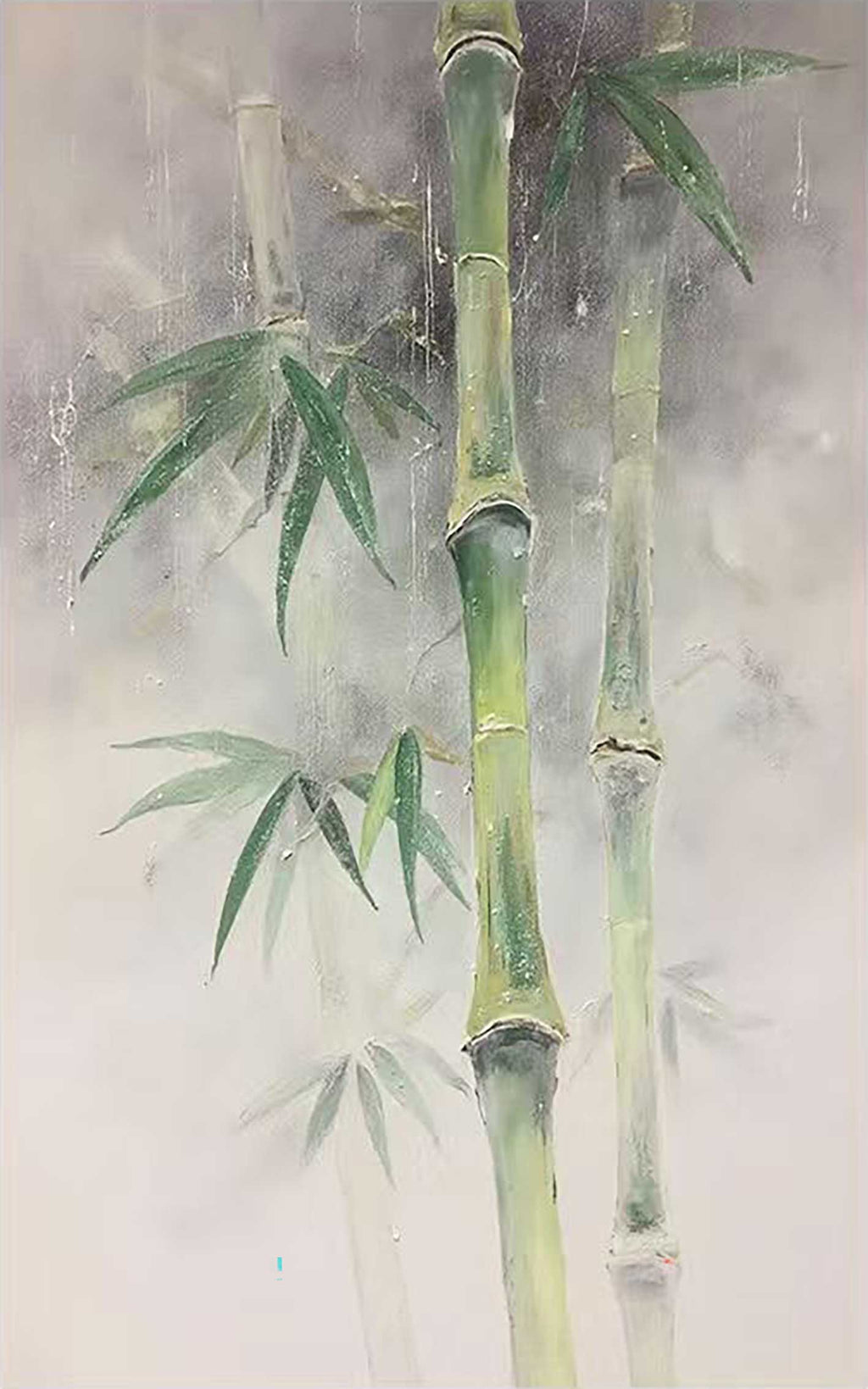 Green bamboo stems and leaves on misty grey