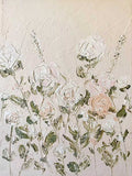 Raised white roses and leaves on a pale textured ground