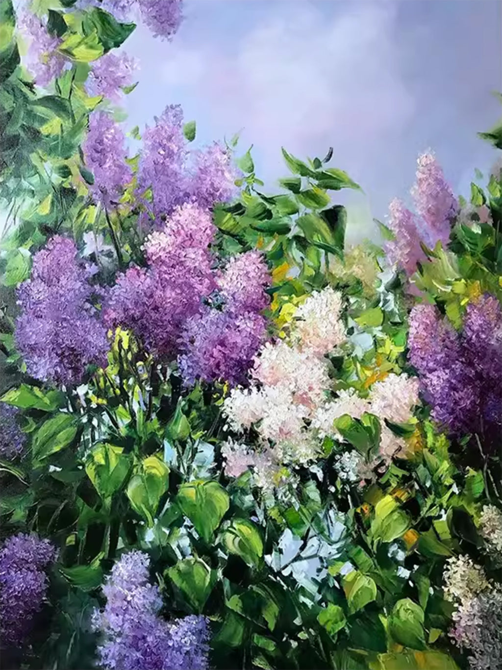 Purple and white lilacs among green leaves under a lilac sky