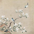 Two blue birds among white magnolia blossoms on pale silk