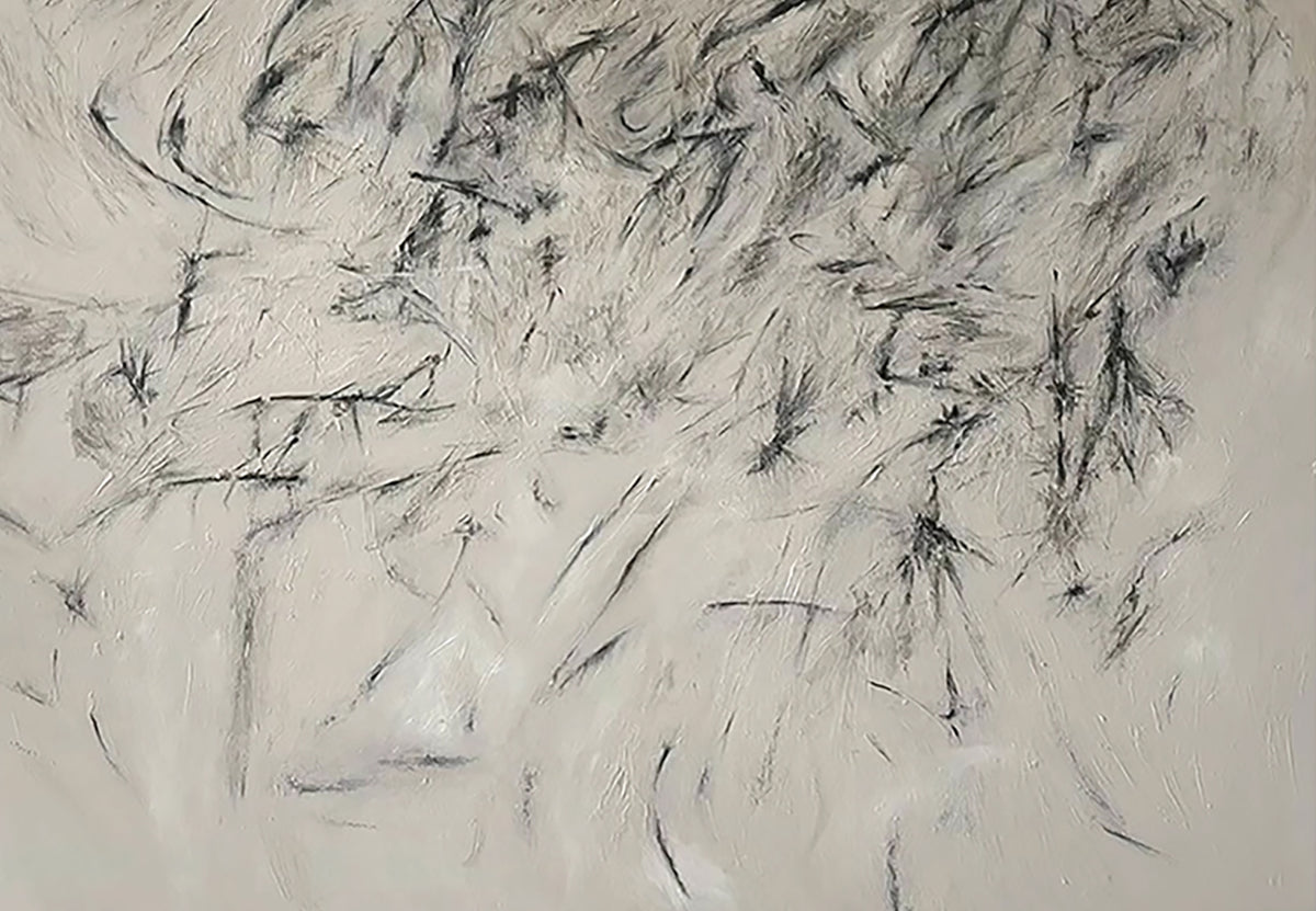 Quick black ink strokes scattered over pale grey