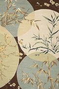 Bamboo and plum sprigs in overlapping pale circles on dark brown