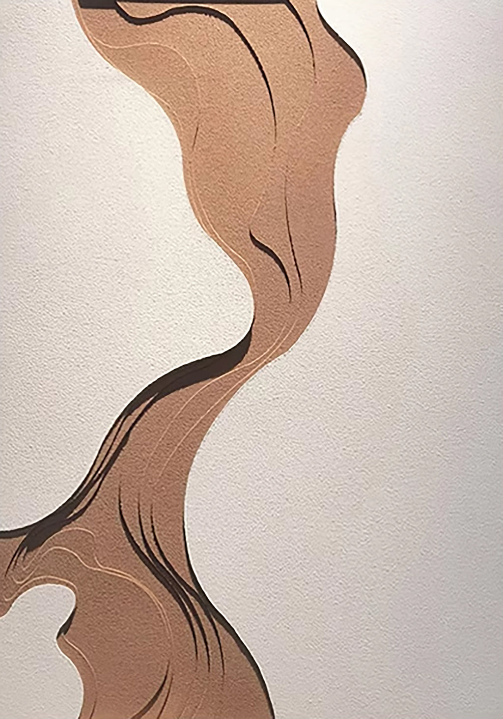 A flowing brown ribbon of paint across a white ground