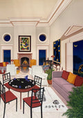 A formal salon with a fireplace, sofas and a card table