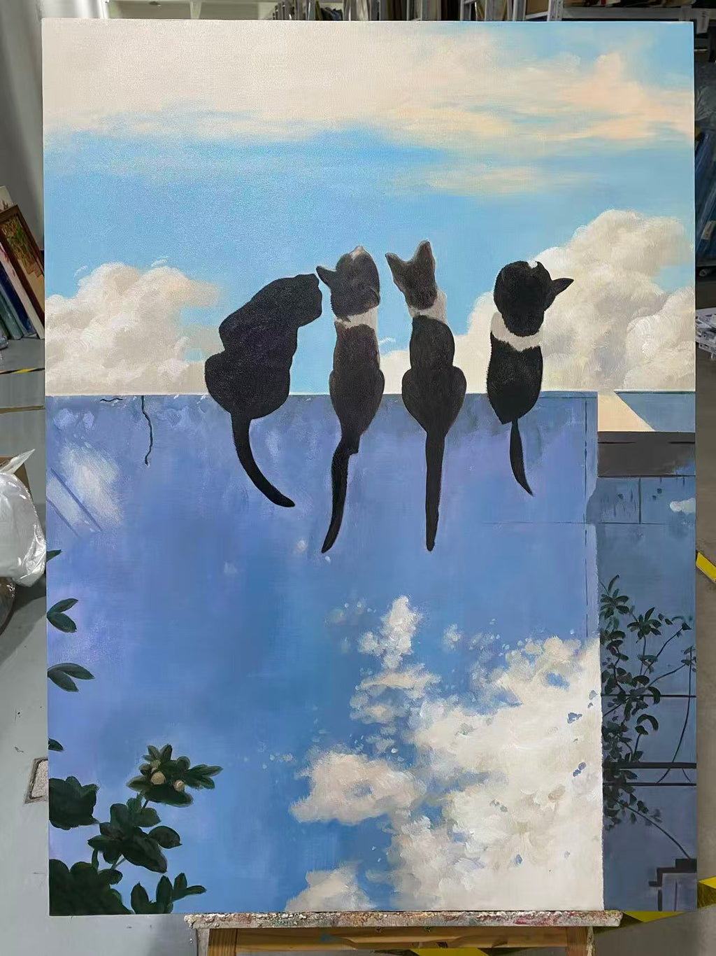 Three Cats on a Blue Wall