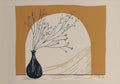 A spray of bare twigs in a black vase in a mustard arch
