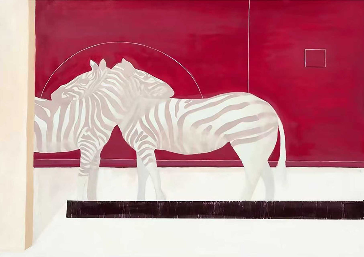 Two pale zebras standing before a deep crimson wall