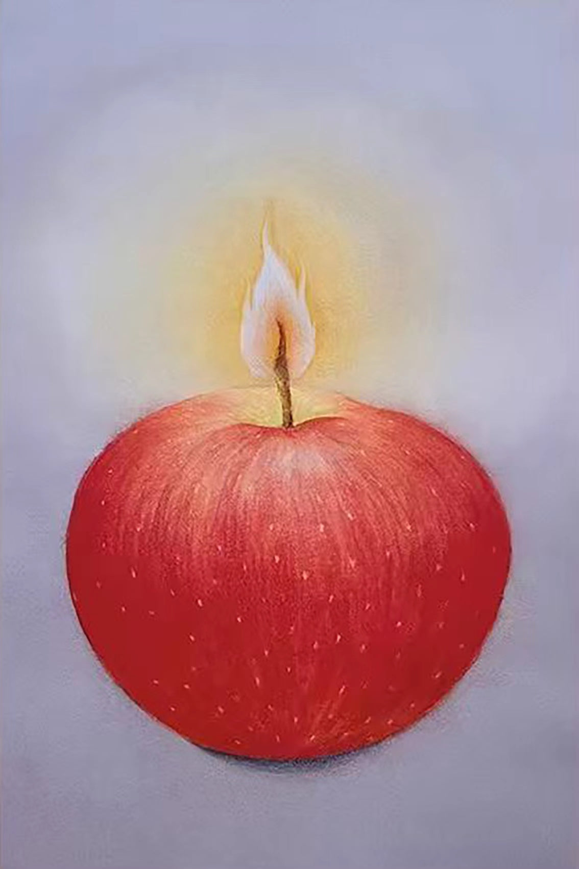 A red apple burning like a candle with a small flame on lilac