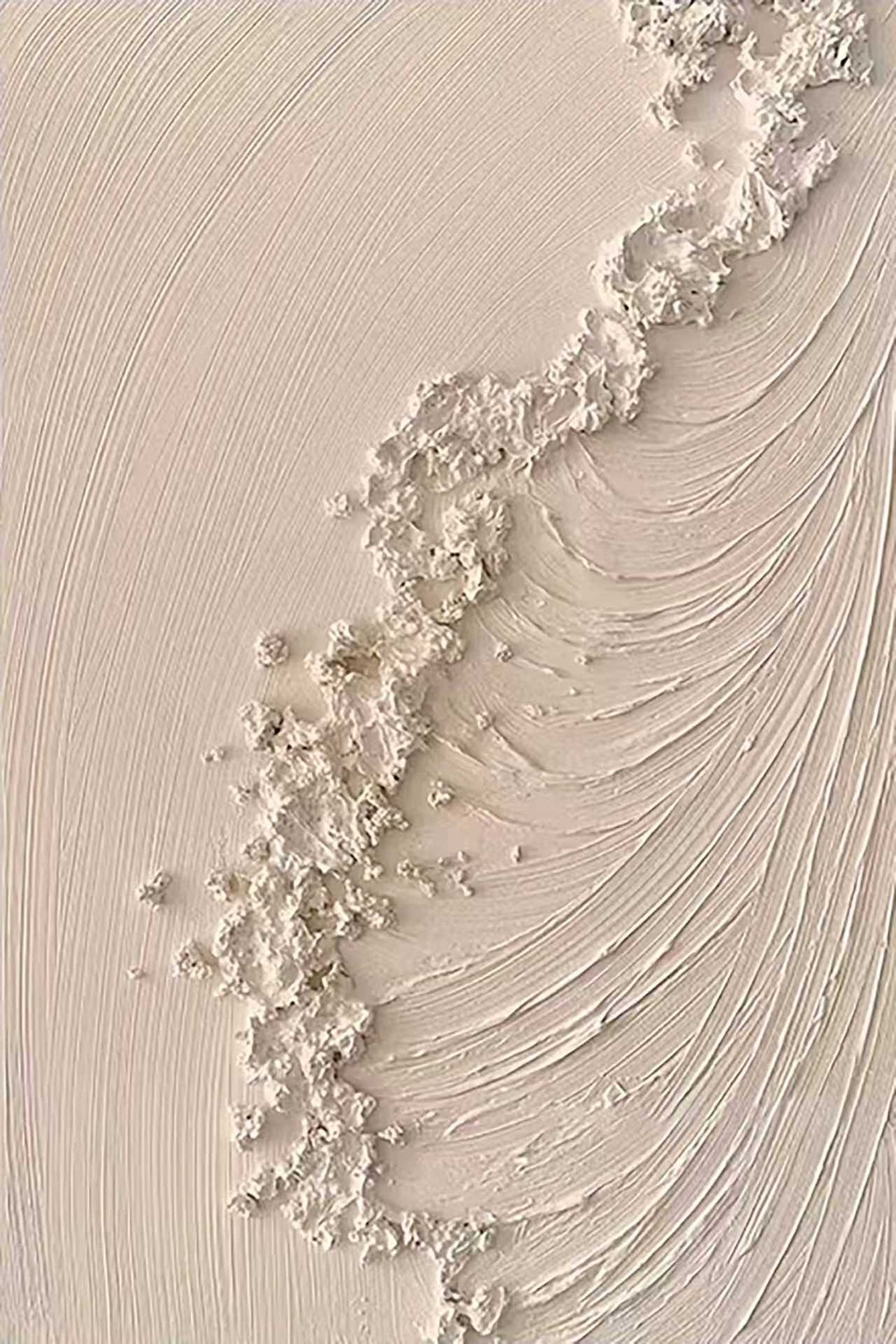 A crest of white foam sculpted over swirling cream lines