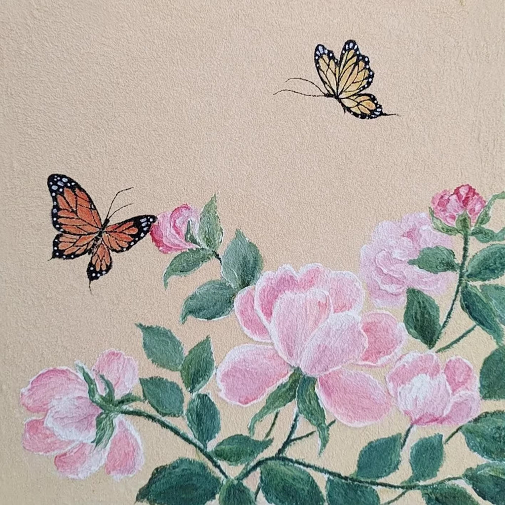 Two butterflies over pink peonies and green leaves on linen