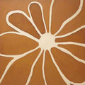 A bold cream outline of a flower on burnt orange