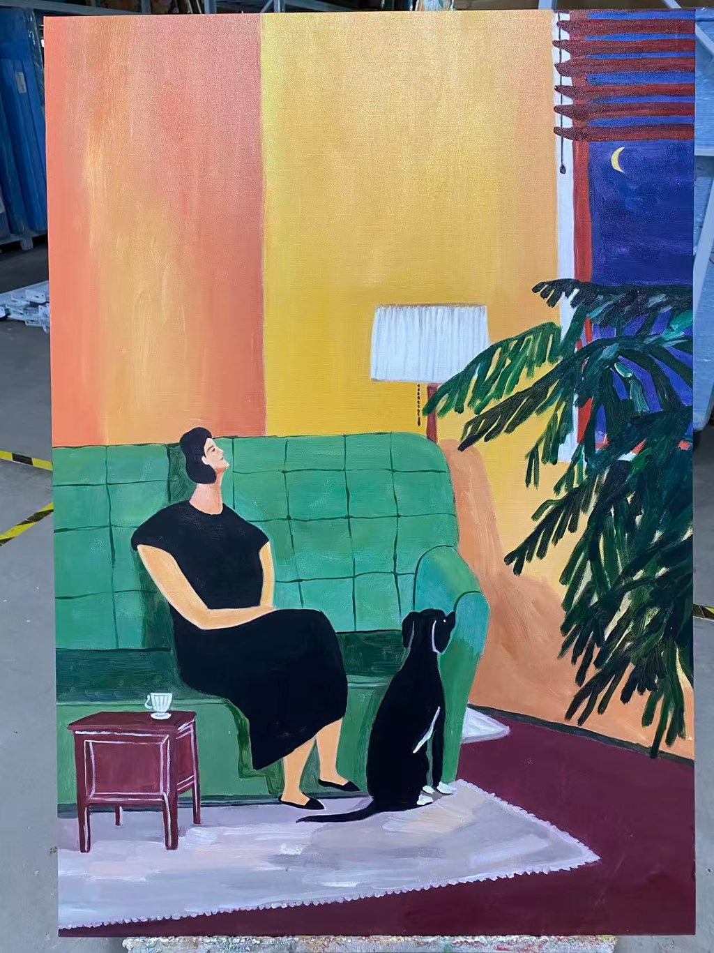 Woman and Dog on the Green Sofa