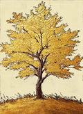 A single tree with blazing gold foliage on a cream field