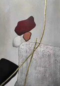 Red, white and black stones balanced on grey, crossed by a gold line