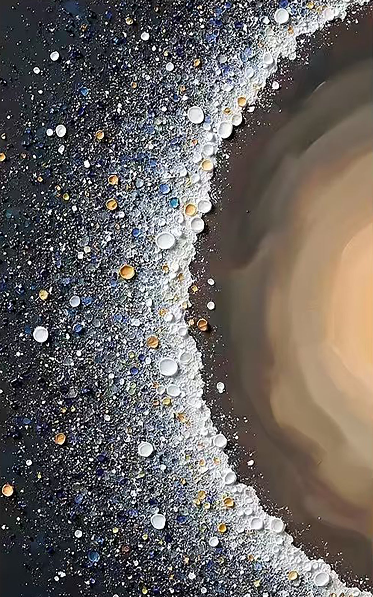 A crescent of pearly dots and glitter around a bronze glow