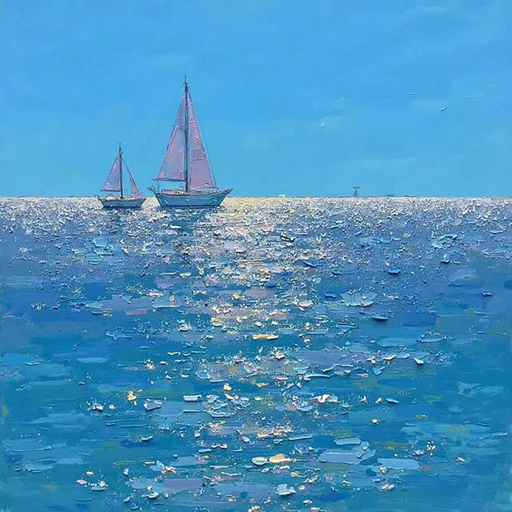 Two sailboats on a sparkling deep-blue sea under a clear sky