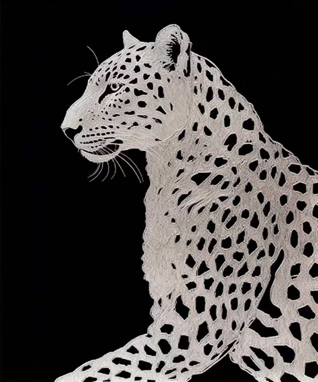 A white leopard with bold black spots against black