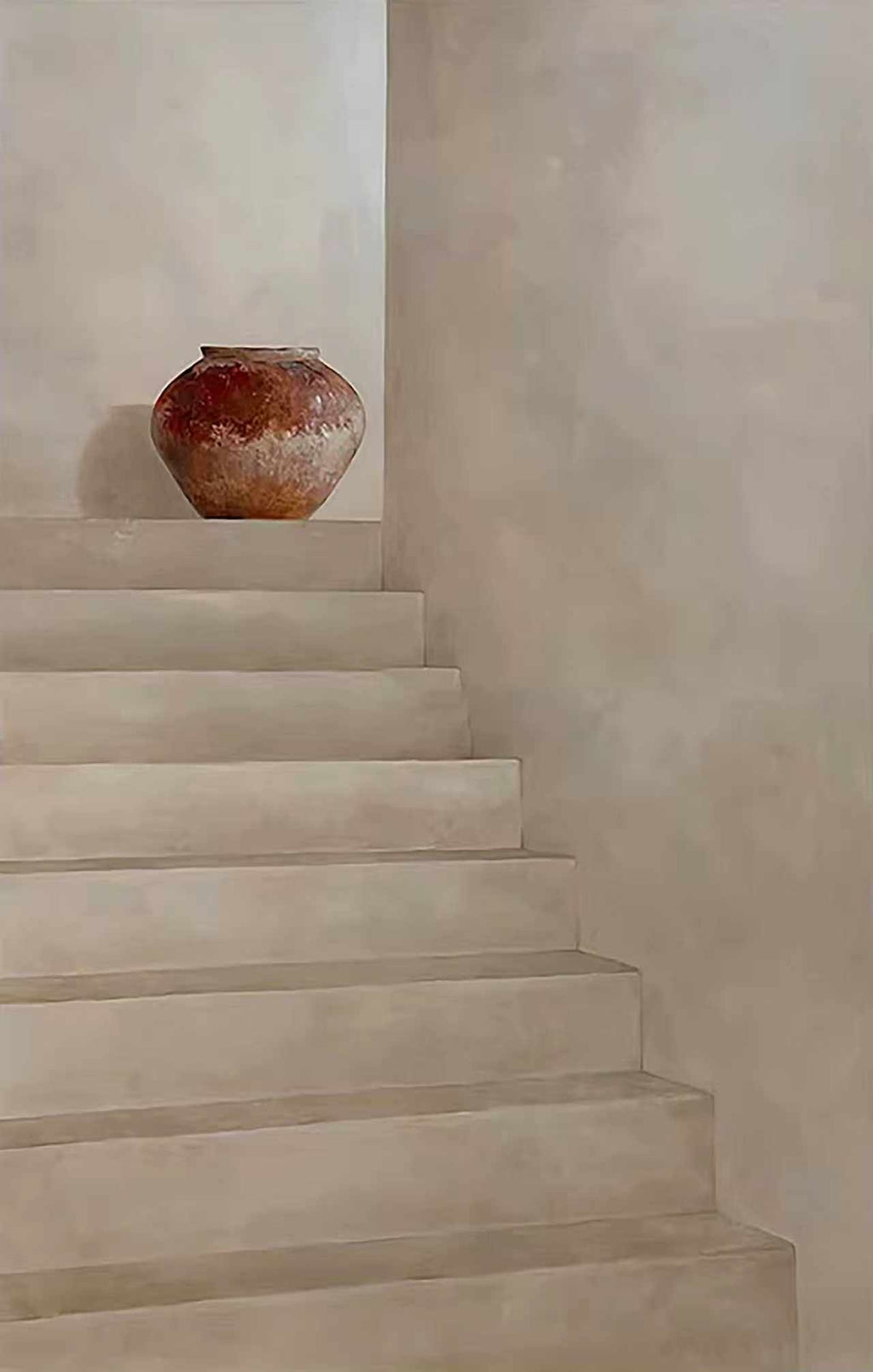 Pale plaster stairs with a terracotta pot on a ledge