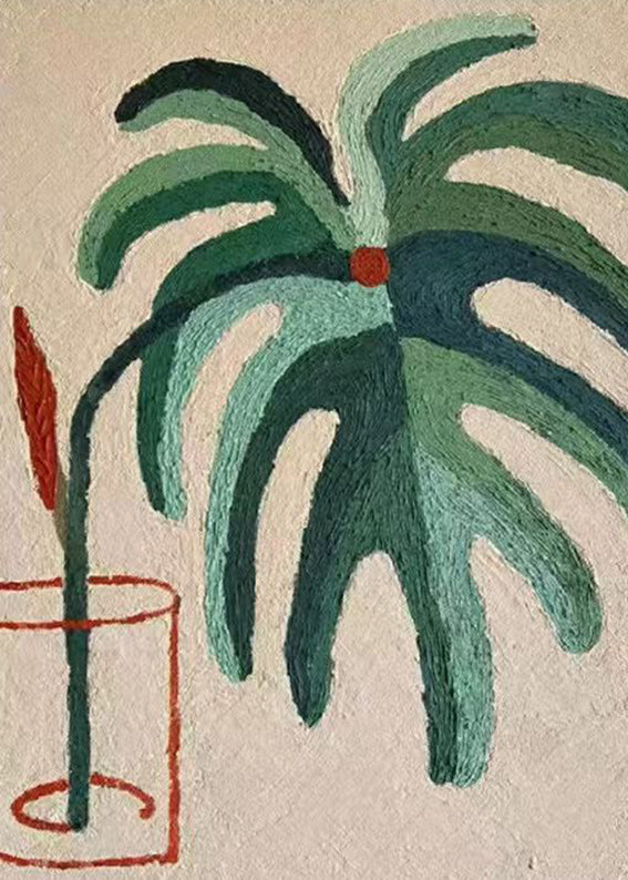 A green palm in a red-outlined glass on beige