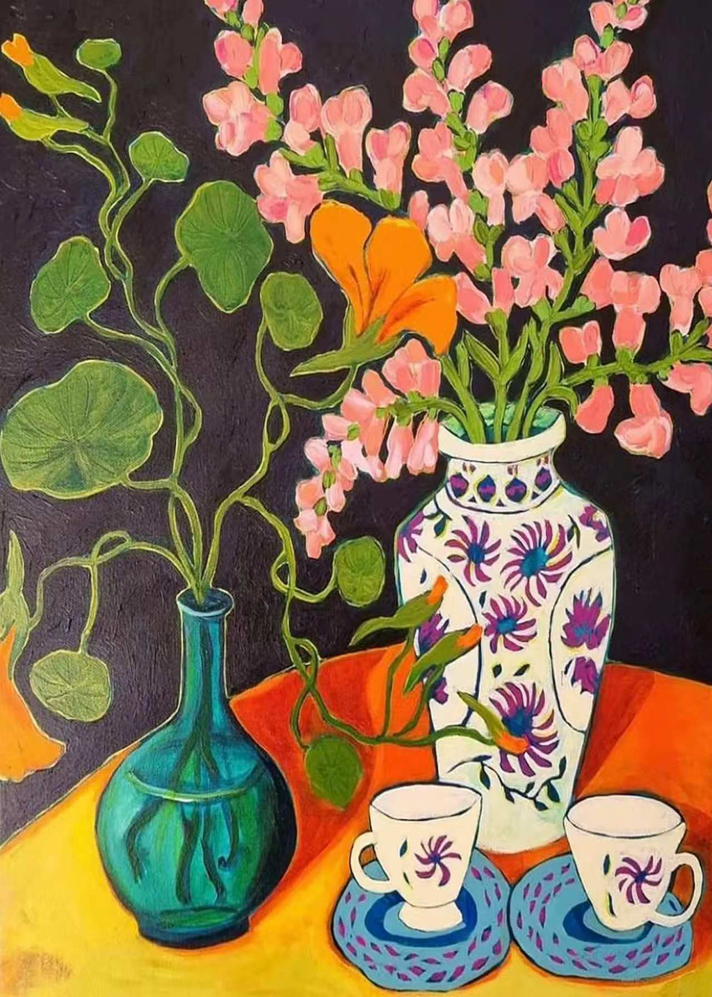 Pink snapdragons in patterned vases with teacups on orange