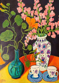Pink snapdragons in patterned vases with teacups on orange