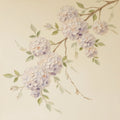 A branch of lilac hydrangea blooms on cream