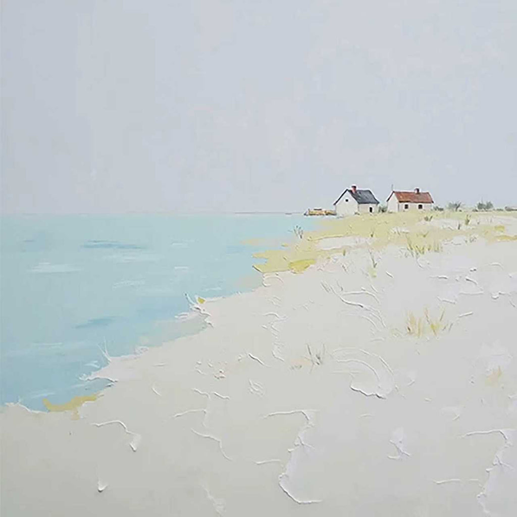 Small cottages on a pale sandy shore by a turquoise sea
