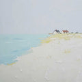 Small cottages on a pale sandy shore by a turquoise sea