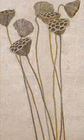 Dried lotus seed pods on tall stems over pale linen