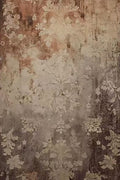 A worn wall of faded floral damask in rust and grey