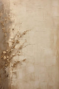 Faint dried grasses brushed over a weathered sand-coloured wall