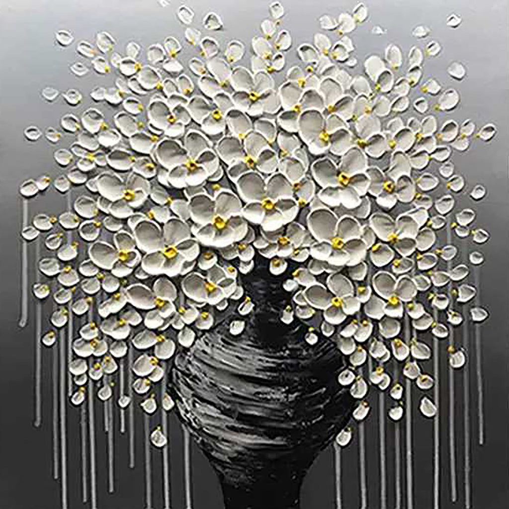 A cascade of white blossoms from a dark vase on grey