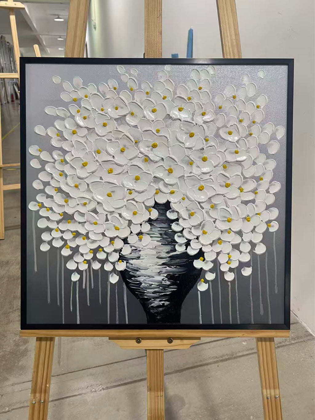 White Blossom Tree in a Black Vase