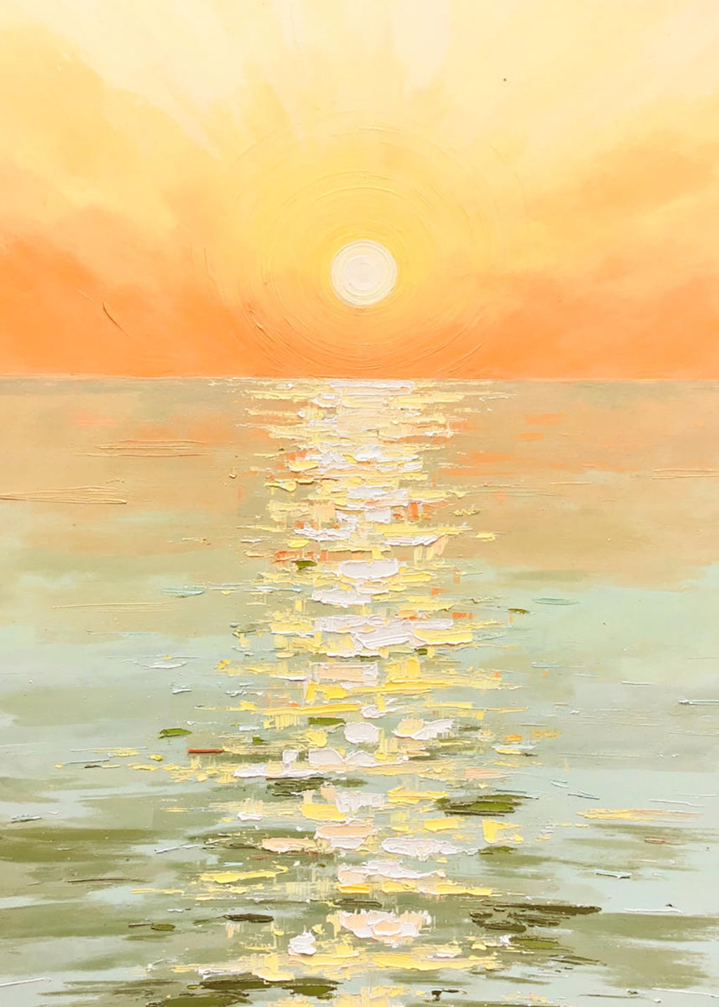A low sun casting a golden path across soft green water