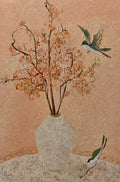 Hummingbirds around a vase of peach blossoms on blush
