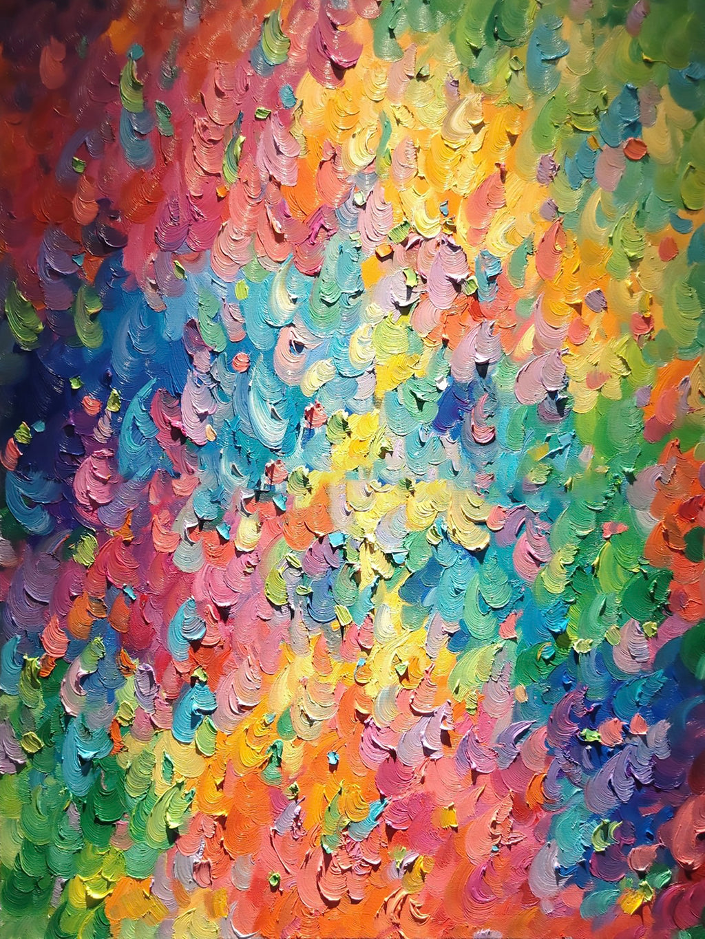 Dense dabs of rainbow colour like a field of petals