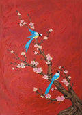 Two blue birds on a blossoming branch against bold red