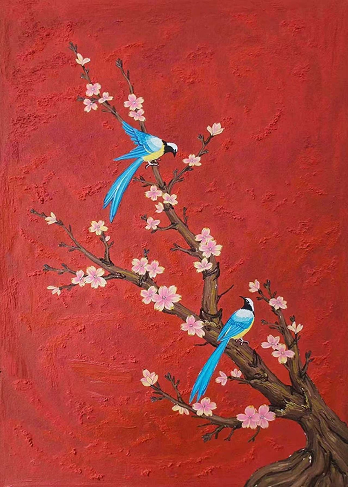 Two blue birds on a blossoming branch against bold red