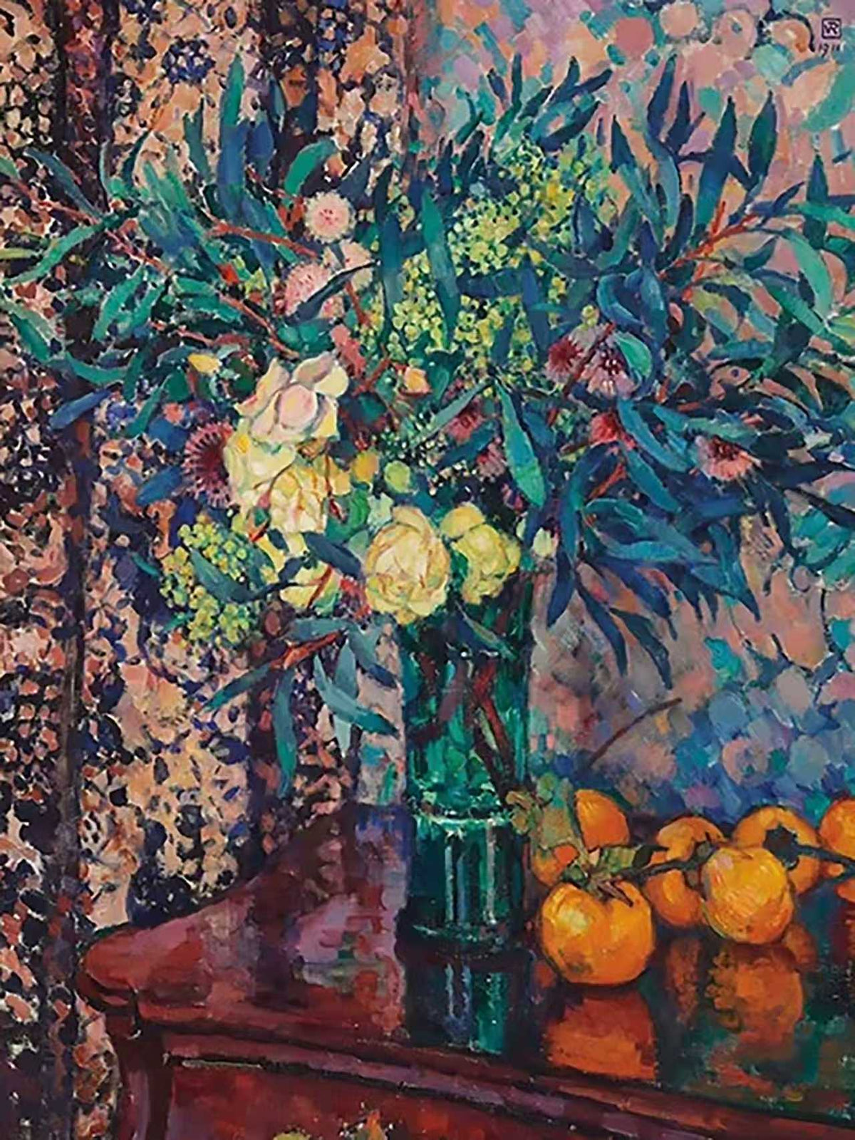A vivid bouquet in glass with oranges on a dark patterned table