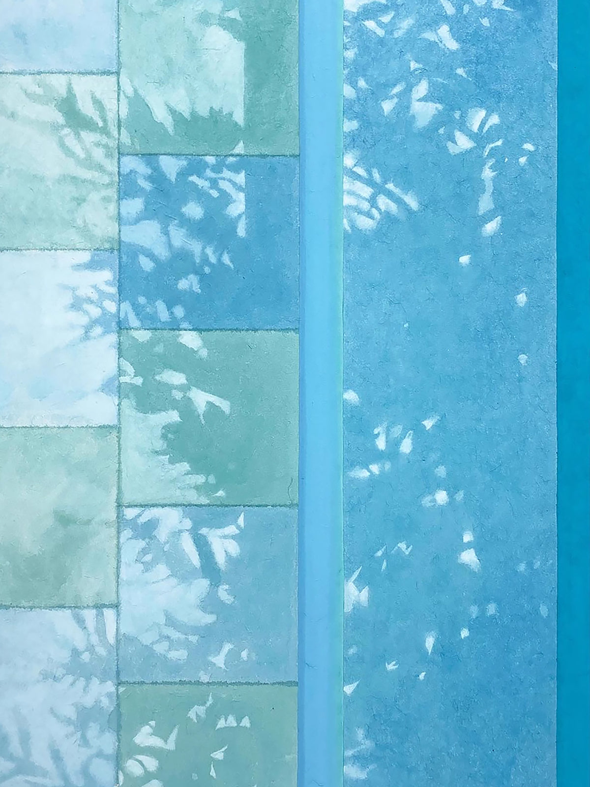 Leaf shadows falling across pale blue tiles