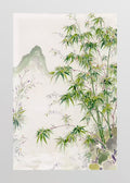 Green bamboo before soft misty hills on cream