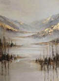 A silvery lake and reeds below misty hills edged with gold