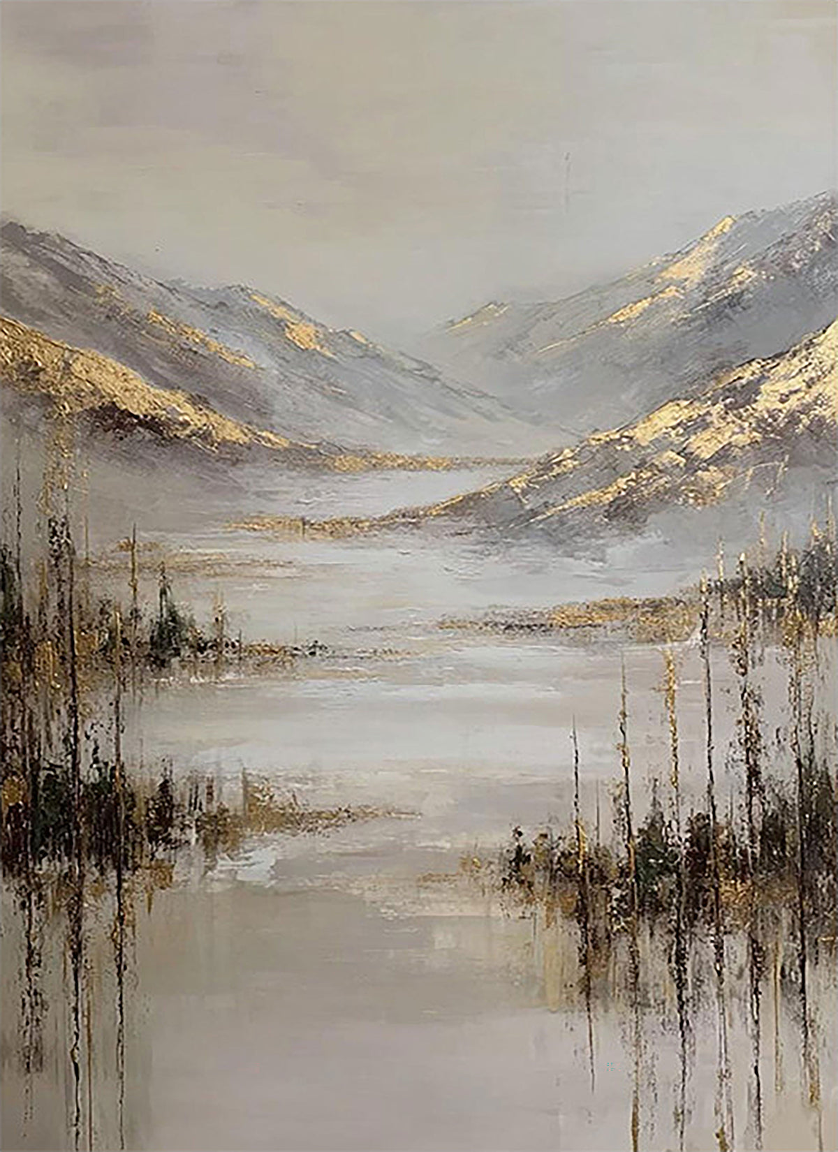 A silvery lake and reeds below misty hills edged with gold