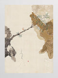 A blossoming branch reaching across fragments of stone on cream