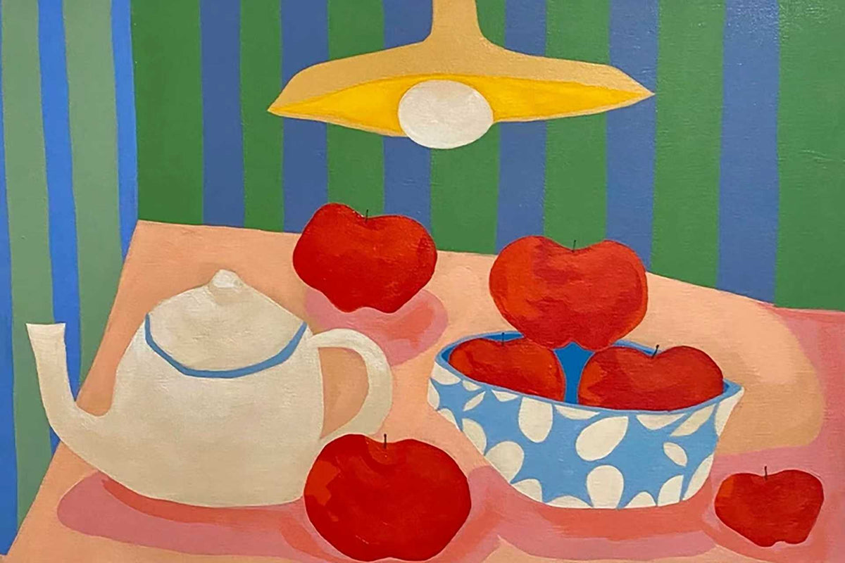 A teapot and red apples in a spotted bowl under a hanging lamp