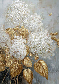 White hydrangea heads and gilded leaves on silver grey