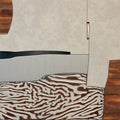 A zebra-striped band among planes of cream, walnut and black