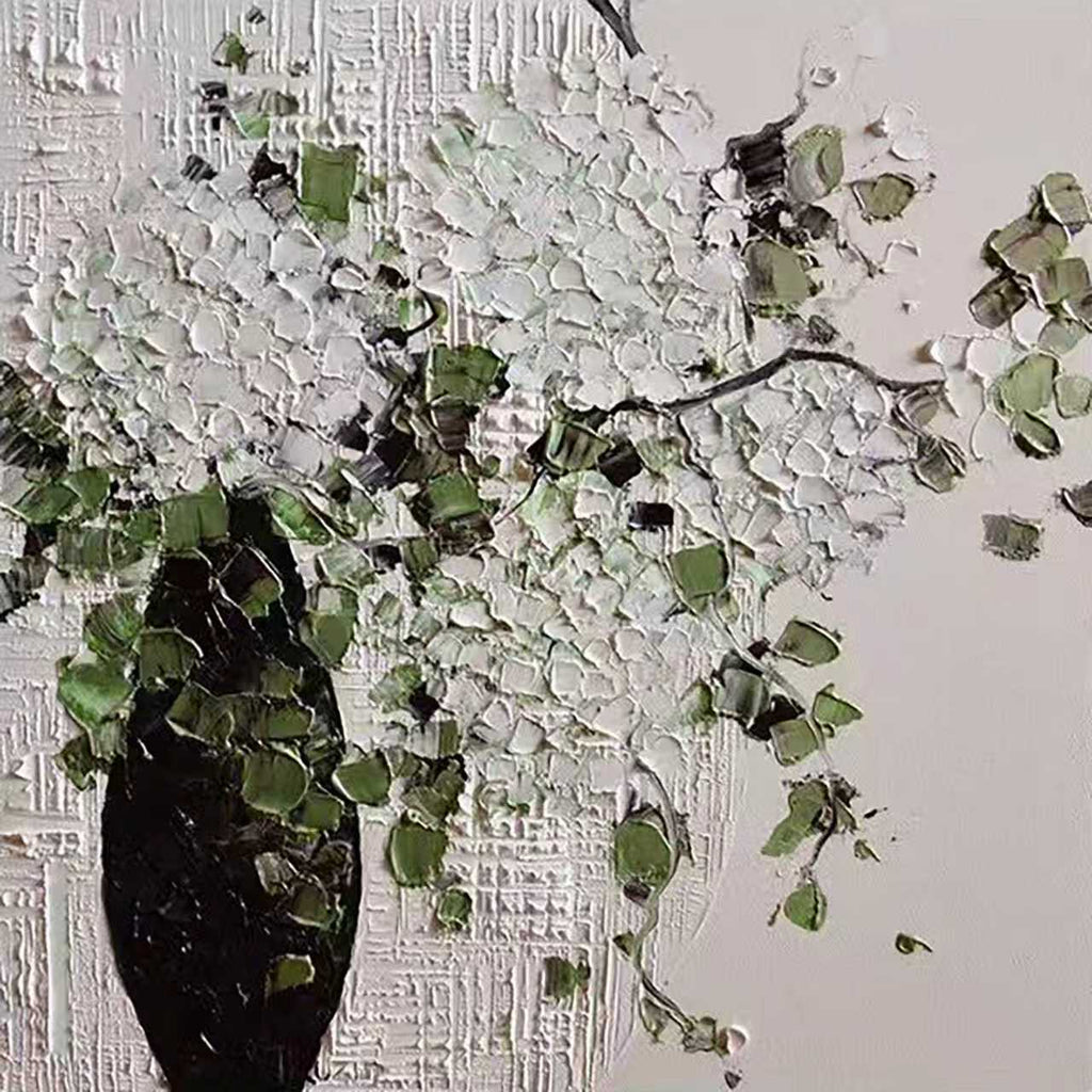 Clusters of white blooms spilling from a black vase in thick relief