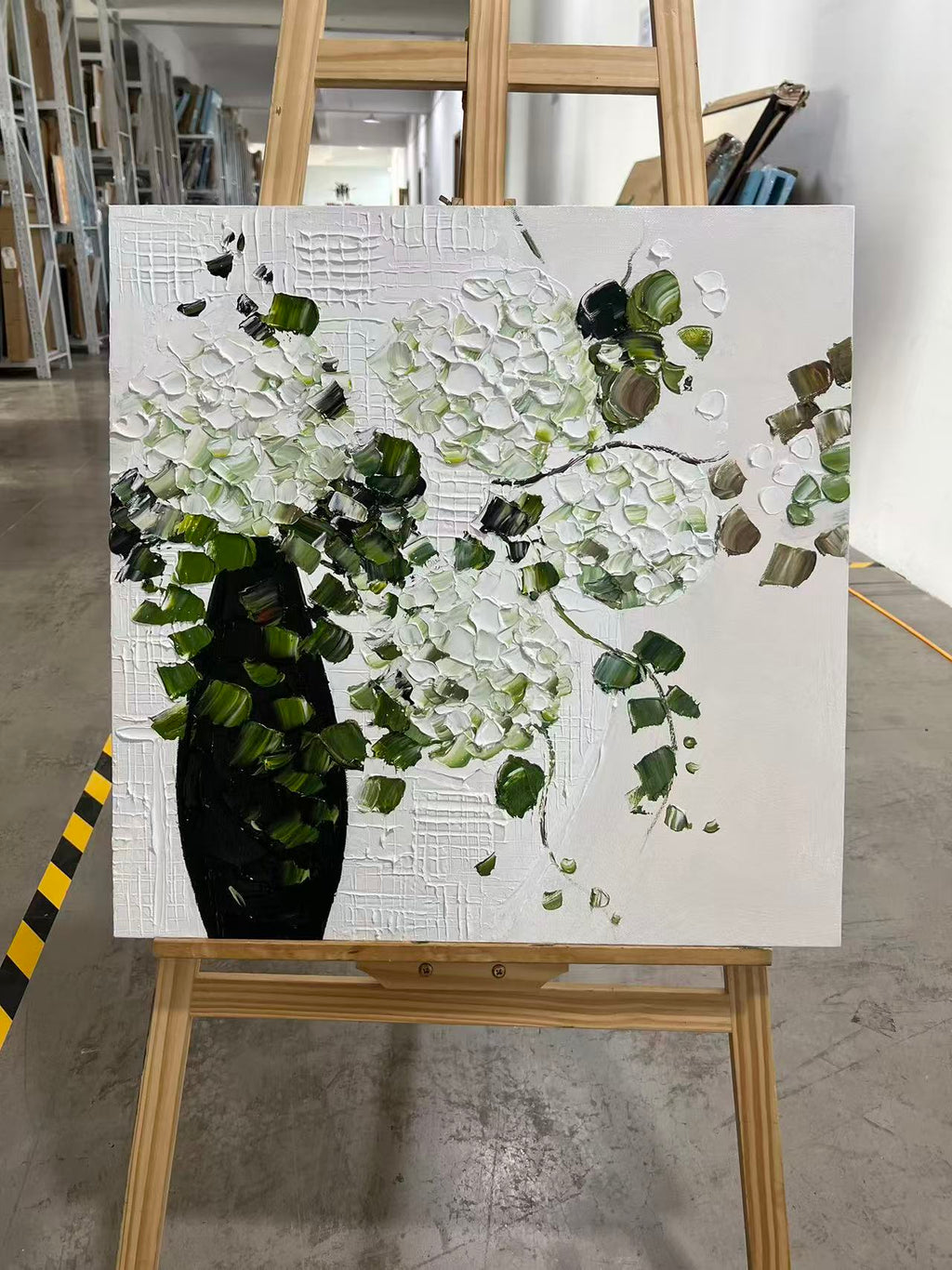 White Blooms in a Black Vase