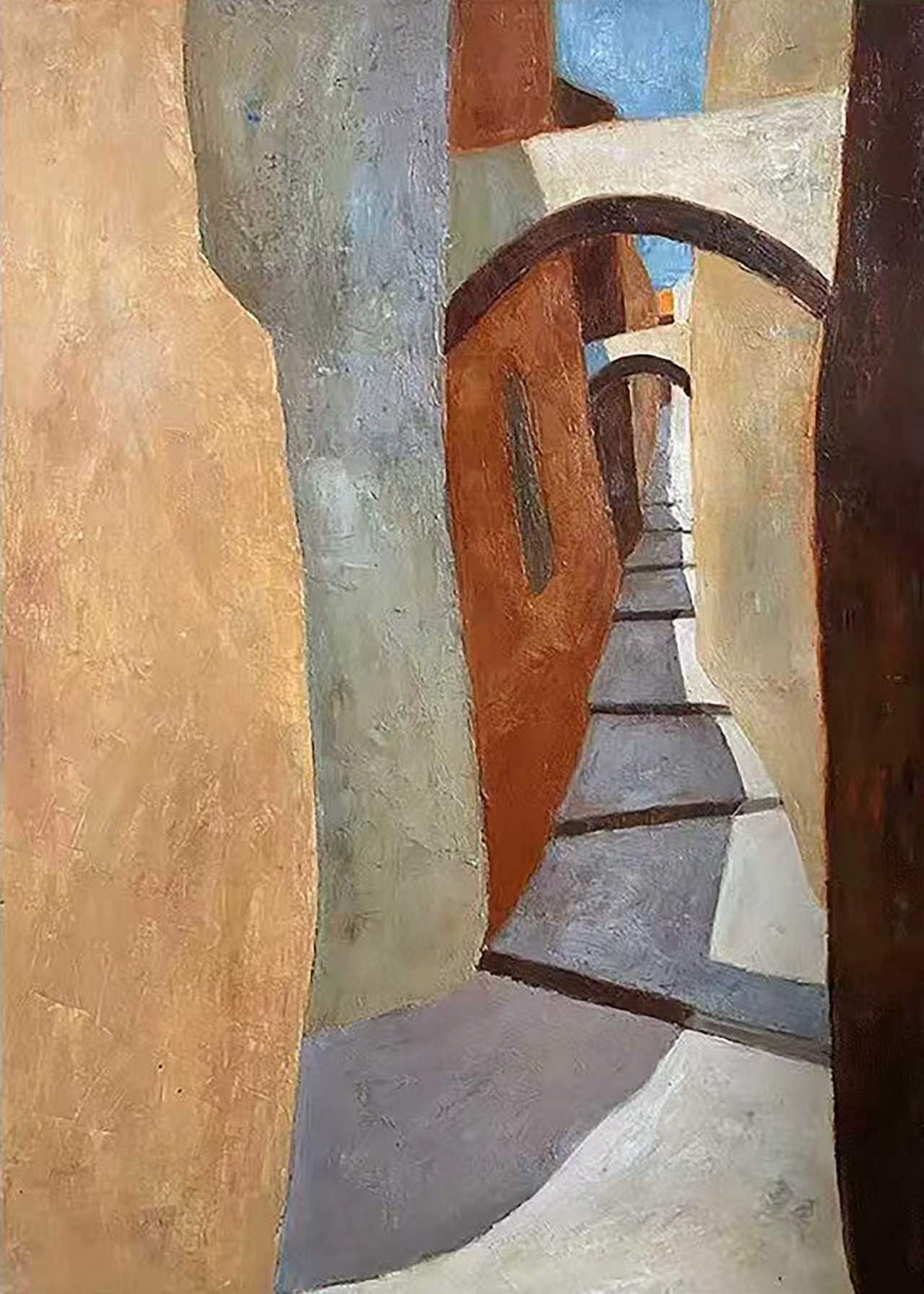 A narrow alley passing under a curved arch in warm ochre walls